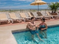 Couple enjoying beachfront pool in Wildwood